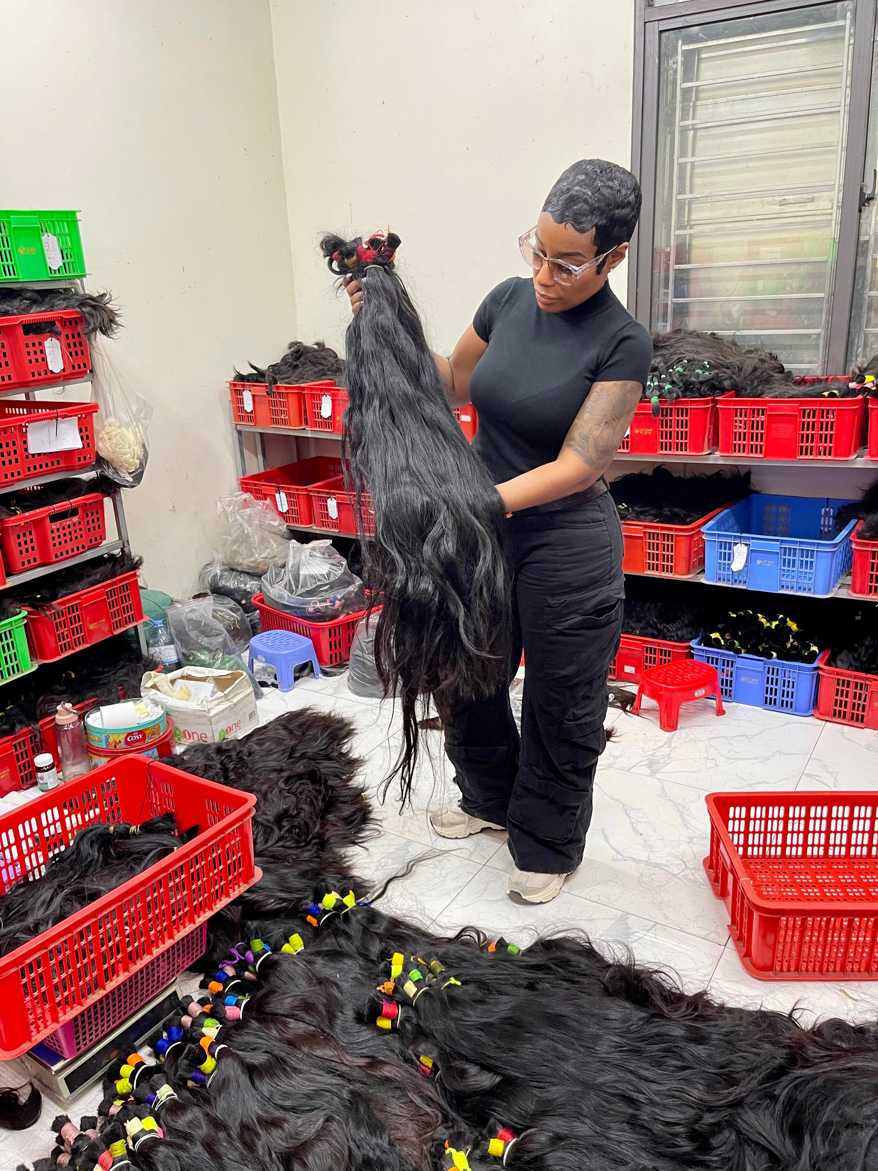 TEASED founder inspecting hair at the source